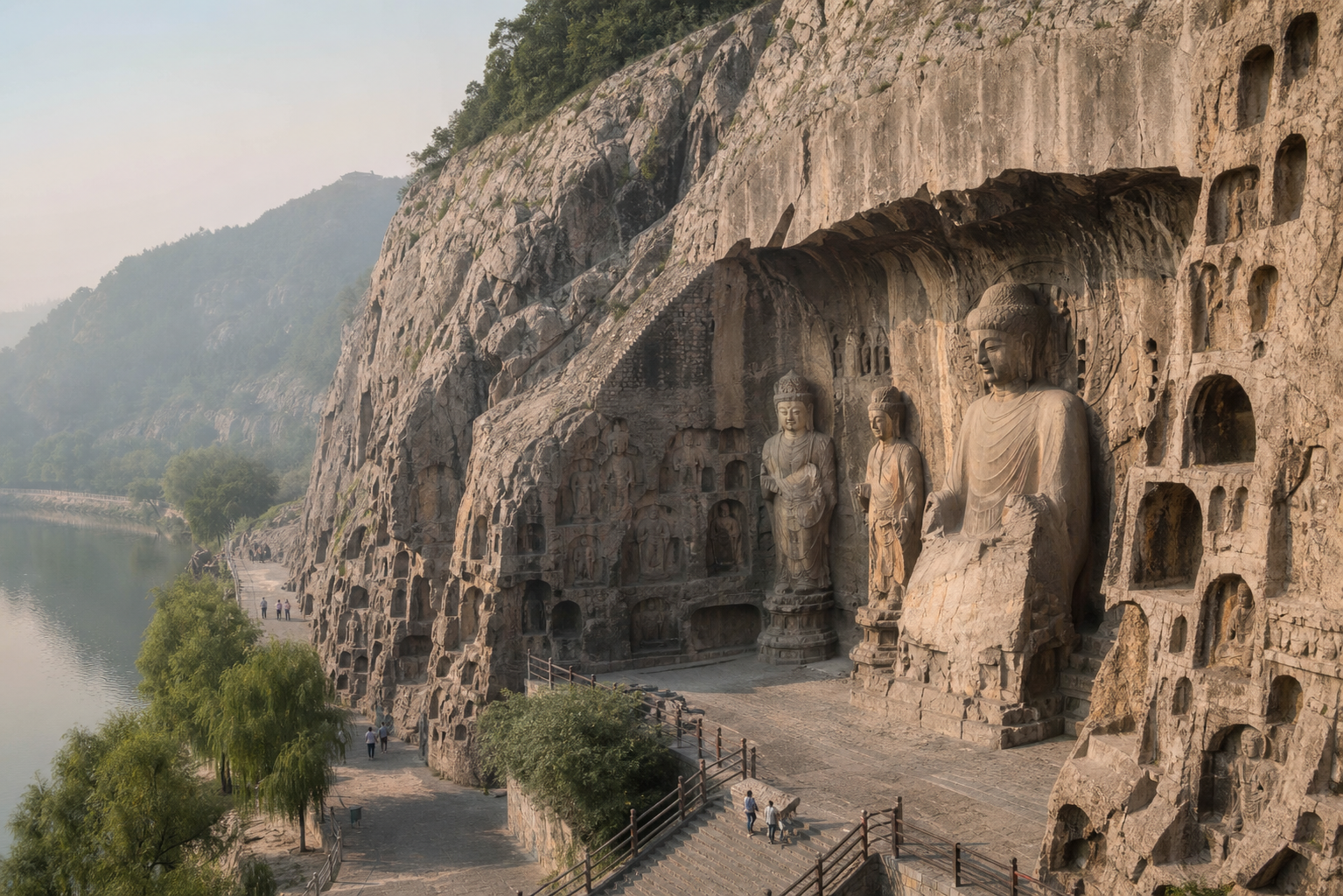 Luoyang cliffside grottoes above a riverside path